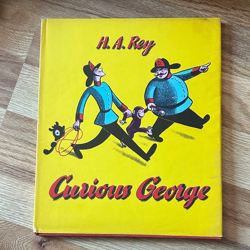 Curious George Book with Firefighters Cover